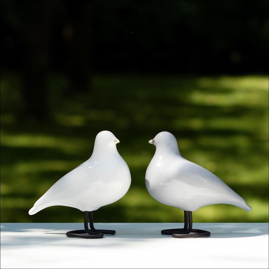 White and grey ceramic bird sculptures displayed together